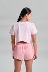 Back view, full length, KYDRA Cross Back Tee in Pink #color_Pink