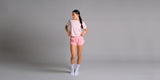 KYDRA Cross Back Tee and Pleated Shorts in Pink, wide banner