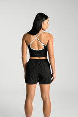 Close view of the back yoke and hem, KYDRA Kara Flex Shorts in Black #color_Black