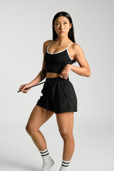 Close view of the drawcord waistband and fabric, KYDRA Kara Flex Shorts in Black #color_Black