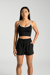 Front view, cropped at the thigh, showing the side pocket, KYDRA Kara Flex Shorts in Black #color_Black