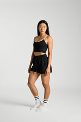Three quarter angle, in movement, KYDRA Lexa Longline Bra in Black #color_Black