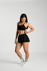 Three quarter angle, in movement, KYDRA Lexi Bra in Black #color_Black