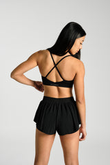 Close view of the cross back straps, KYDRA Lexi Bra in Black #color_Black
