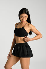 Close view of the strap and neckline, KYDRA Lexi Bra in Black #color_Black