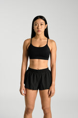 Front view, cropped at the hip, KYDRA Lexi Bra in Black #color_Black