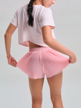 Close view of the back waistband and pleats, KYDRA Pleated Shorts in Pink #color_Pink